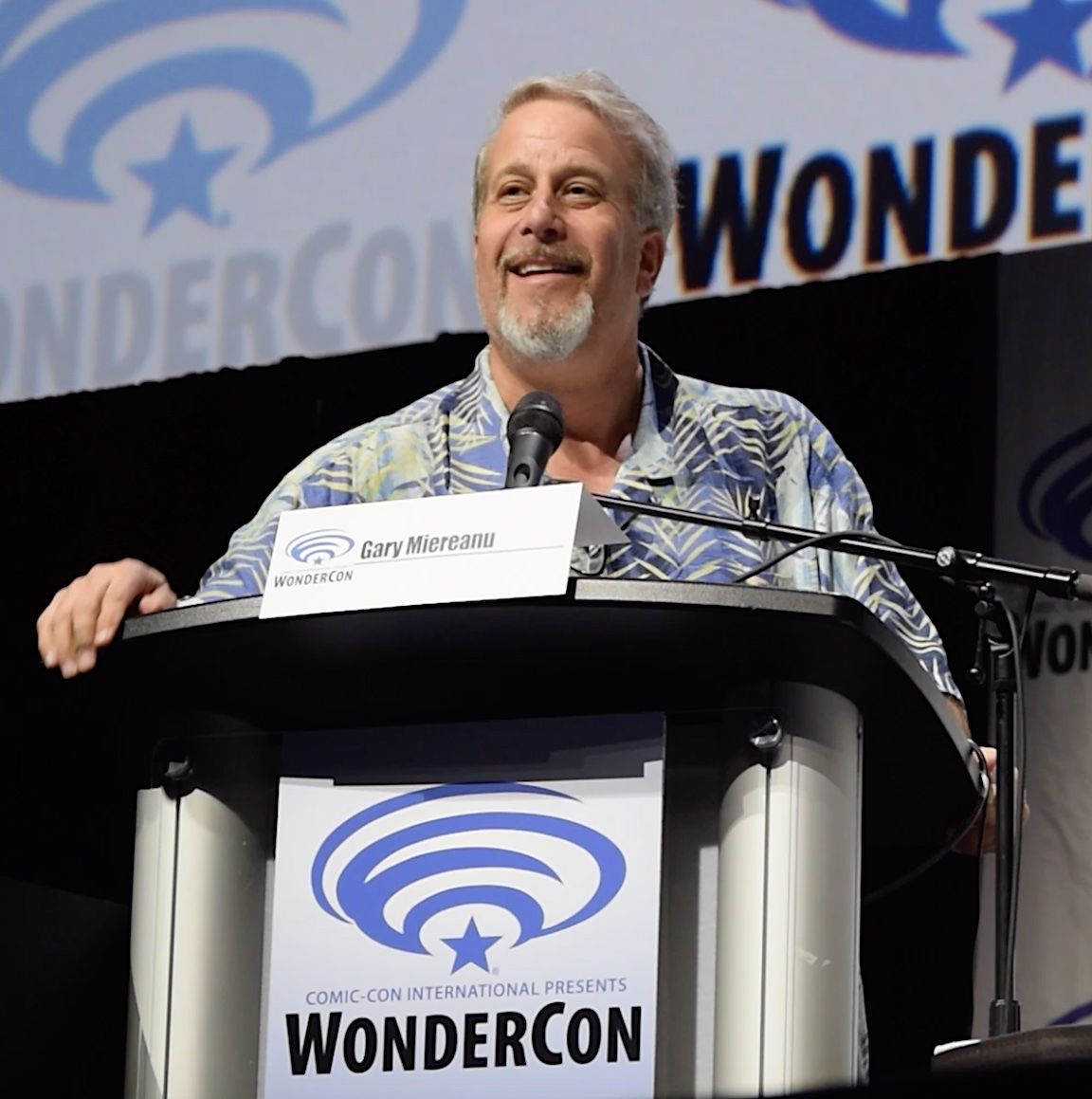 Publicist Gary Miereanu, pictured here moderating a panel in the cavernous Anaheim Arena at WonderCon 2019, has orchestrated more than 600 panels at conventions across North America, and moderated more than 400 of those gatherings in front of crowds of up to 6,500 attendees.