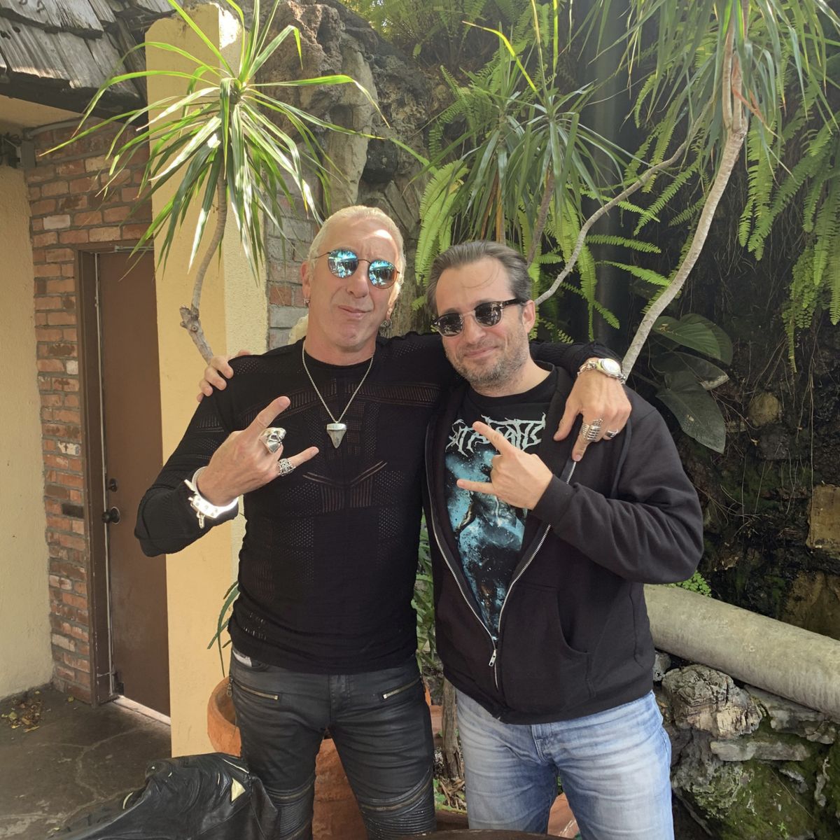 Producer Christopher Petzel discussing film projects with Twisted Sister's Dee Snider.